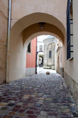 Lviv, Ukraine - August 2022.Old Armenian Cathedral of the Assumption of Mary in Lviv . Armenian courtyard at dawn. Architectural landmark in the center of Lviv.