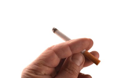 A Cropped of man hand holding cigarette pointing up against white background. A cigarette in a hand, isolate hand and cigarette, cigarette white background .