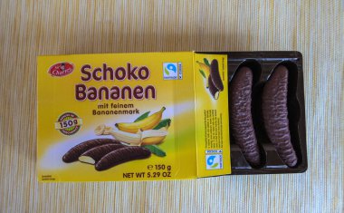 Lviv, Ukraine, March 2023.chocolate bananas ,Mini banana covered with chocolate .Mini banana and ladyfingers covered with chocolate foam.