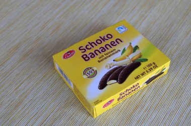 Lviv, Ukraine, March 2023.chocolate bananas ,Mini banana covered with chocolate .Mini banana and ladyfingers covered with chocolate foam.