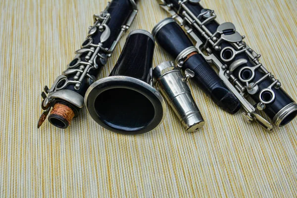 Top View Black Clarinet Dismantled Four Parts Gray Weathered Wooden — Stock Photo, Image