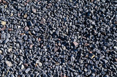 Arka plan dokusu için kullanılan küçük taşlar duvar. Rock desenli arka plan. Kusursuz çakıl dokusu. ezilmiş granit dokusu.