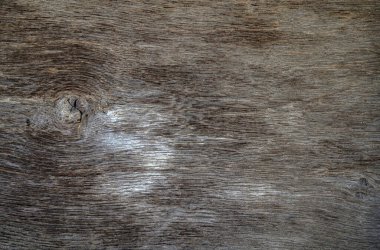 Kahverengi ahşap yapısı doğal ağaçtan geliyor. Tahta panelin güzel koyu bir deseni var, ahşap döşeme dokusu.