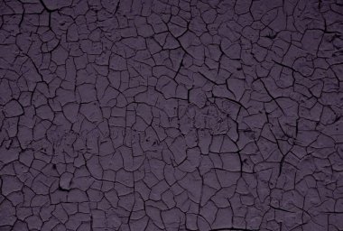 Duvardaki boyayı soymaya yakın. Duvardaki boyayı kırmaya ve soymaya. Çatlaklar ve soyulma şekilleriyle eskimiş sert boyalı yüzey. Arkaplan ve tasarım için yüksek çözünürlüklü doku.