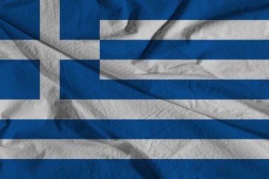 Yunanistan bayrağı saten veya ipek üzerine bayrak dikti. Yunanistan bayrağının kıvrımlı saten dokusu.