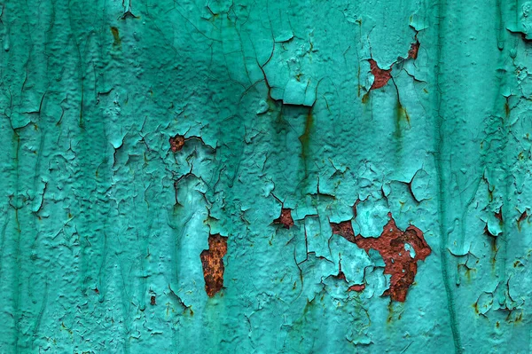 The texture of old rusty metal covered with peeling turquoise (blue, green) paint. Background for the design.