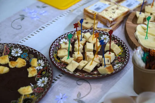 Tasting cheese dish with herbs and fruits wooden table. Food for wine and romantic, cheese delicatessen. Menu design horizontal. Top view.