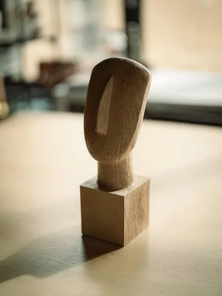 wooden figure on a wooden table