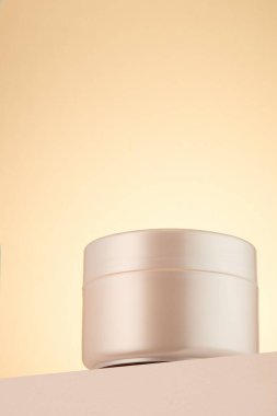 Closed plastic jar of skin care cream. One object. Copy space.