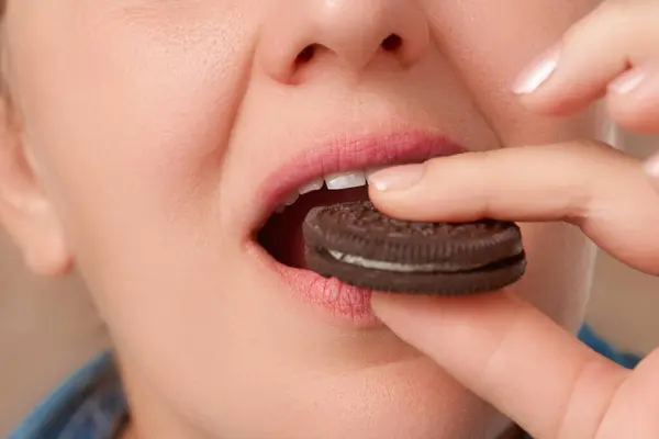 Close Mouth Pretty Caucasian Woman Biting Chocolate Chip Cookie Sandwich Royalty Free Stock Images