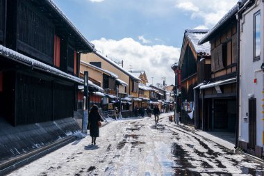 Kyoto, Japan - January 24 2023 : Hanamikoji Street with snow in winter. Gion District.