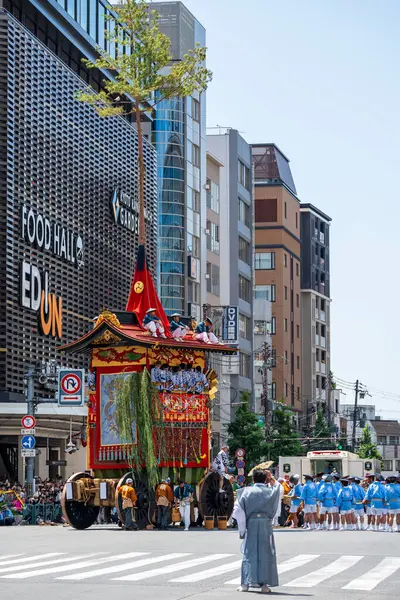 stock image Kyoto, Japan - July 24 2023 : Gion Matsuri Festival, Yamaboko Junko Procession. People pulling the large wooden traditional float parade on the city street.