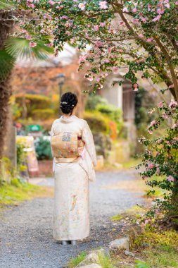 Japanese Female Kimono portrait photography with flowers in full bloom.