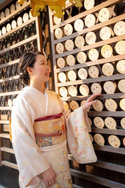 Japanese Female Kimono Portrait photography. Kyoto, Japan in the autumn season. Fall foliage.