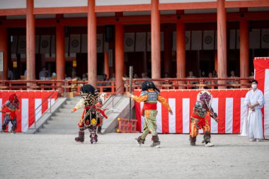 Kyoto, Japan - February 3 2024 : Heian Jingu Shrine Setsubun festival. Performers wearing an oni ( demon or ogre ) costume in the traditional Japanese shinto ritual ceremony. clipart