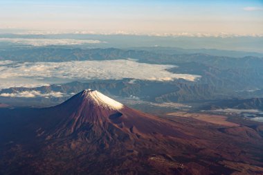 A birds eye view close-up the Mount Fuji ( Mt. Fuji ) and blue sky. Scenery landscapes of the Fuji-Hakone-Izu National Park. Shizuoka Prefecture, Japan clipart