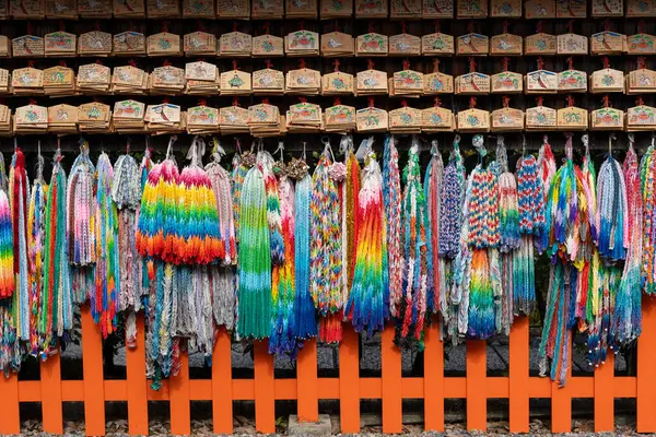 Thousand folded paper cranes and ema votive pictures in Azumamaro Shrine (Azumamaro Jinja) in the Fushimi Inari Taisha Shrine. Kyoto, Japan.