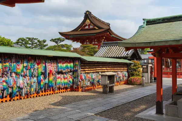 Thousand folded paper cranes and ema votive pictures in Azumamaro Shrine (Azumamaro Jinja) in the Fushimi Inari Taisha Shrine. Kyoto, Japan.