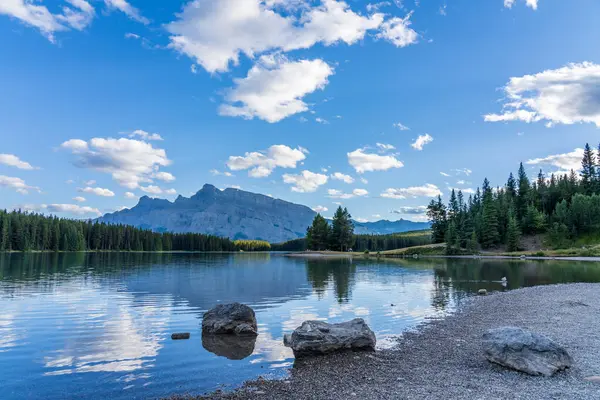 stock image Two Jack Lake beautiful landscape in summer day. Mount Rundle with blue sky, white clouds reflected on water surface. Banff National Park, Canadian Rockies, Alberta, Canada.