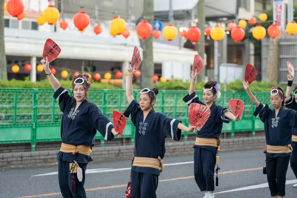 stock image Tokushima Prefecture, Japan - August 14 2024 : Tokushima Awa Odori Festival 2024. Performers wear traditional obon costumes, dance and sing as they parade through the streets.