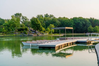 Montreal, Quebec, Canada - August 20 2021 : Mount Royal Park ( Parc du Mont-Royal ) Beaver Lake in summer sunset time. clipart