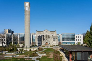 Vancouver, BC, Canada - April 5 2021 : University of British Columbia Library Special Collections Division and Ladner Clock Tower. UBC campus.