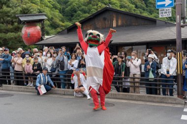 Arashiyama, Kyoto, Japan - May 25, 2025 : Saga Matsuri Kanko-sai Festival featuring a traditional Shishimai lion dance performance, a vibrant cultural display on the streets.