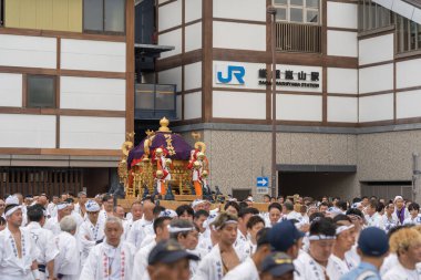 Arashiyama, Kyoto, Japan - May 25, 2025 : Saga Matsuri Kanko-sai festival Nonomiya Shrine mikoshi, a sacred purple portable shrine paraded through the streets.