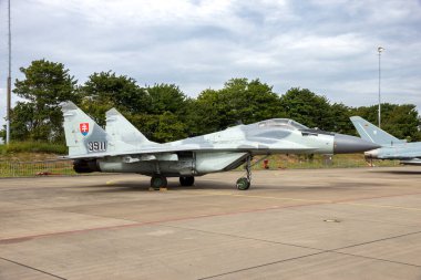 Slovak Air Force MiG-29 Fulcrum fighter jet plane on the tarmac of Leeuwarden airbase. Leeuwarden, The Netherlands - June 10, 2016 clipart