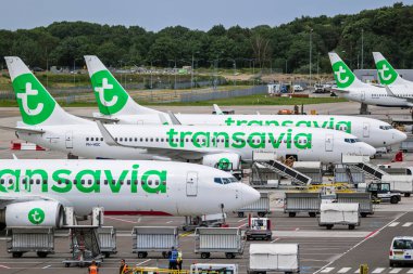 Transavia low-cost airline passenger planes on the tarmac of Eindhoven Airport. The Netherlands - June 29, 2020 clipart