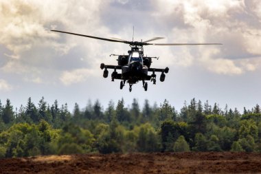  Boeing AH-64 Appache attack helicopter hovering. Veluwe, The Netherlands - September 17, 2022 clipart