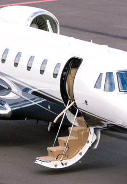 Modern corporate business jet on the tarmac of an airport. clipart