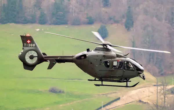 stock image Swiss Air Force Eurocopter EC635 helicopter in flight. Alpnach, Switzerland - February 27, 2024