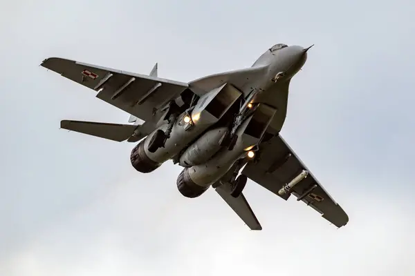 stock image Polish Air Force MiG-29 Fulcrum fighter jet on final approach at Leeuwarden Air Base. Leeuwarden, The Netherlands - April 11, 2018