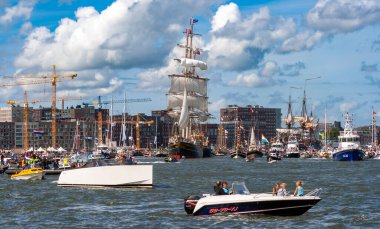 Three-masted clipper  'Stad Amsterdam' arrives at Amsterdam during the SAIL-In parade for SAIL2010. Amsterdam, The Netherlands - Aug 19, 2010 clipart