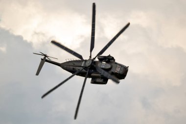 German Air Force Sikorsky CH-53 Stallion transport helicopter in flight over Fliegerhorst Jagel, Germany - June 13, 2019 clipart