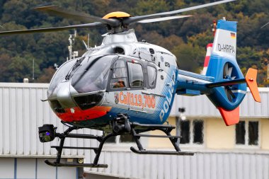 Airbus Helicopters EC135 helicopter from the German Police taking off. Koblenz-Winningen, Germany - 12 October, 2024 clipart