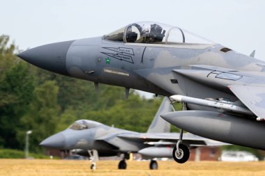 US Air Force F-15C Eagle fighter jet from 104th Fighter Wing taking off from Hohn Airbase during NATO exercise Air Defender 2023. Hohn, Germany - June 15, 2023 clipart