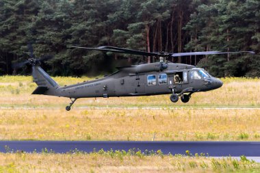 US Army Sikorsky UH-60M Black Hawk helicopters taking off. The Netherlands - June 22, 2018 clipart