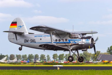 Antonov An-2 biplane landing. Leeuwarden, The Netherlands - Jun 10, 2016 clipart