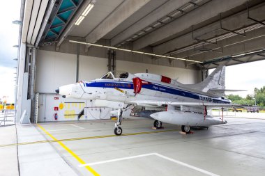 Douglas A-4N Skyhawk fighter jet plane from BAe Flight Systems in a hangar at Laage Air Base. Laage, Germany - August, 23 - 2014 clipart