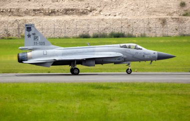 Pakistan Air Force PAC JF-17 Thunder fighter jet taking off from Le Bourget Airport. Paris, France - June 20, 2019 clipart