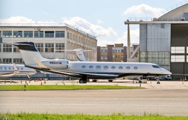 Gulfstream G650ER business jet on the tarmac off Le Bourget Aerodrome. Paris, France - June 21, 2019 clipart