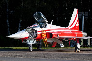 Northrop F-5E Tiger II jet from Patrouille Suisse with open M39A2 cannon gun bay on the tarmac at Kleine-Brogel Air Base. Peer, Belgium - September 13, 2021 clipart