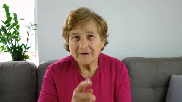 Old Woman Points Her Finger Quietly Selective Focus People — Video