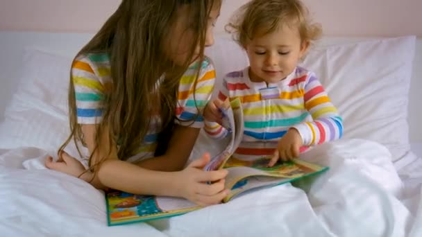 Children Read Book Bed Selective Focus Kid — Vídeos de Stock