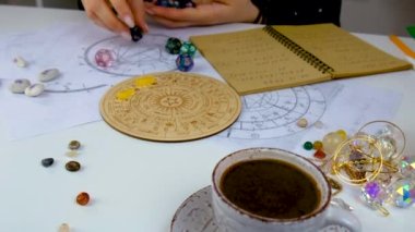 Woman numerologist astrologer counts numbers. Selective focus. People.