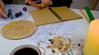 Woman numerologist astrologer counts numbers. Selective focus. People.