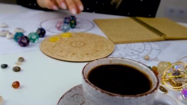 Woman numerologist astrologer counts numbers. Selective focus. People.