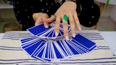 Fortune teller woman reads tarot cards. Selective focus. Magic.